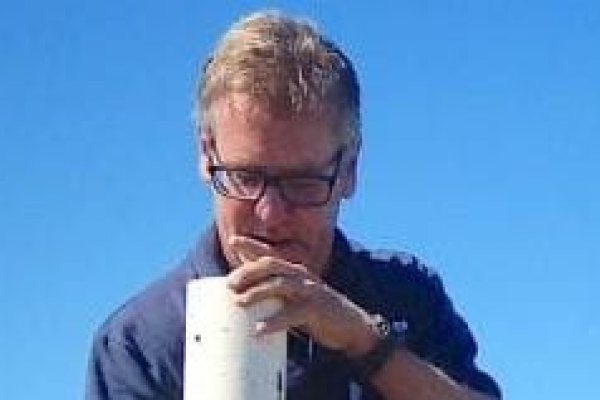 John Rybczyk takes field samples